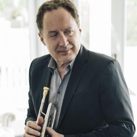 O instrumento escolhido por Isham acabou sendo o trompete e com ele conseguiu posição de destaque em orquestras de Oakland e São Francisco. Mas paralelamente a música clássica, o gênero que sempre empolgou Isham foi o jazz, aos vinte anos já se tornou seu gênero preferido. Um músico que executava jazz no trompete, ao mesmo tempo em que se interessava por música eletrônica.